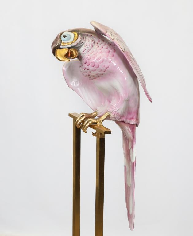 Mangani for Oggetti Porcelain Parrot Sculpture: Hollywood Regency sculpture, an Italian porcelain and brass life-sized pink and white parrot with 24k gold accents, mounted to a brass and black acrylic stand. Made by Giulia Mangani for Oggetti; no m