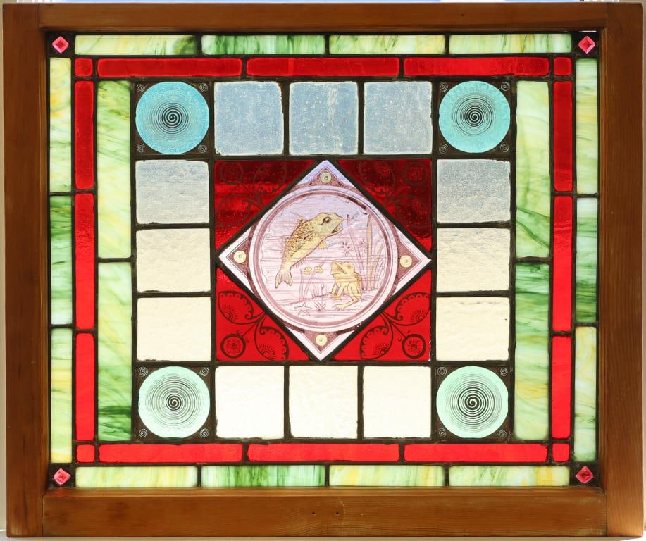 Late 19th c. Leaded Stain Glass Window Panel: Hand painted fish and frog center diamond motif with foliate and spiral decoration surrounded by slag, jeweled, and frosted glass panels housed in a dovetail oak frame. 23"h x 28"w x 2"d