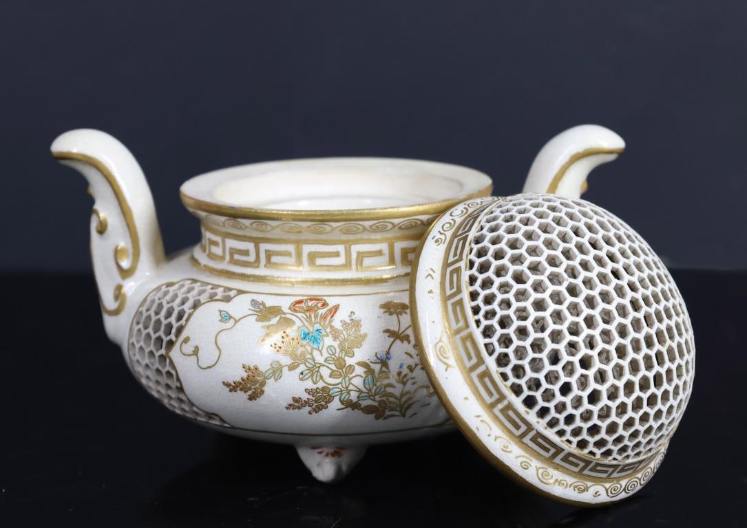 Tokozan Japanese Satsuma Pottery Reticulated Censer: Meiji - Showa era censer with reticulated sides and cover, floral decoration, meander and scroll borders, and handles, all raised on tripod feet. Marked "Satsuma / Tokozan-sei / Shungaku-in" (Satsuma 