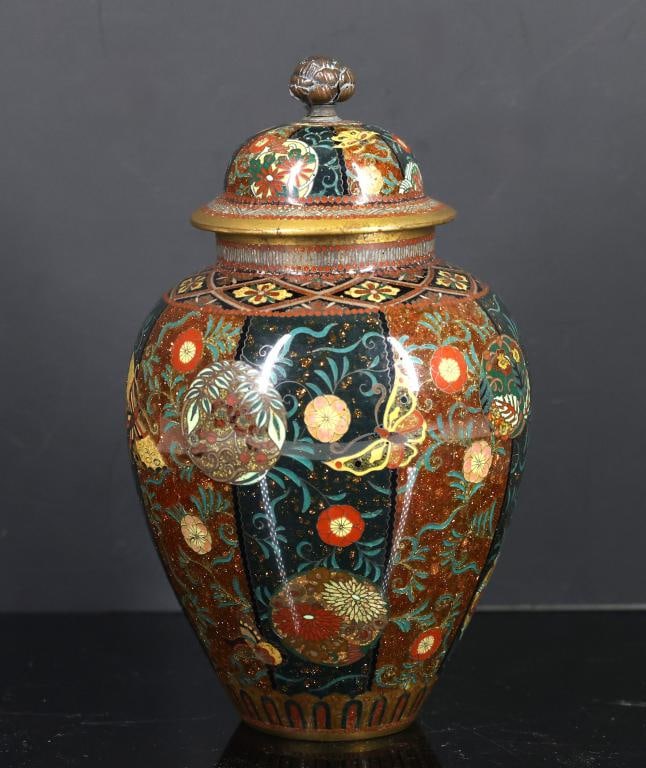 Japanese Goldstone Cloisonne Urn: Meiji - Taisho era silver wire cloisonne urn with goldstone accents and gilding, decorated with red and green vertical bands decorated with scrolling stylized chrysanthemums, overlaid with flower ball