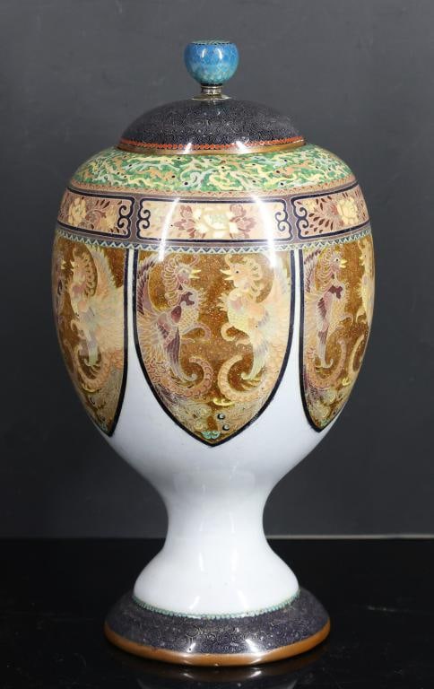 Japanese Cloisonne Urn: Meiji - Taisho era silver wire cloisonne pedestal urn with goldstone accents, decorated with lappets containing confronted phoenixes on a periwinkle ground, the base decorated with wire scrolls on a b