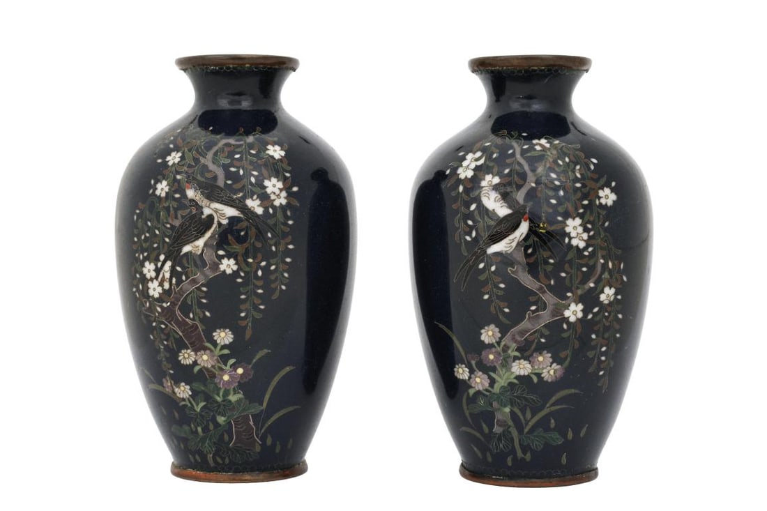 Japanese Cloisonne Vases: Meiji - Taisho era pair of small silver wire cloisonne vases, each depicting a pair of swallows perched in a cherry tree among blossoms and chrysanthemums, on a midnight blue ground. Unmarked. Each ha