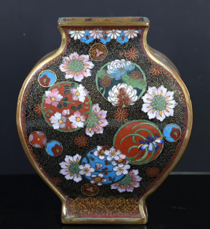 Japanese Cloisonne Vase: Meiji - Taisho cloisonne bulbous squared vase with gilding and goldstone accents, decorated with flower balls and mons on a black ground with wire scrolls and fish roe borders. Unmarked. Some minor en