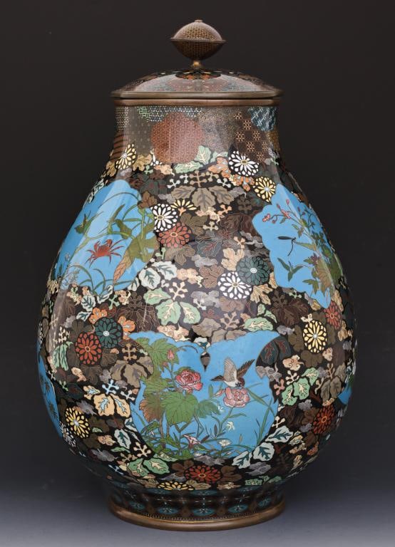 Japanese Cloisonne Urn: Meiji - Taisho era large silver wire cloisonne urn with gilding, decorated with sky blue panels depicting cranes, a hawk, a sparrow, a swallow, and a crab among assorted flowers, surrounded by leaves 