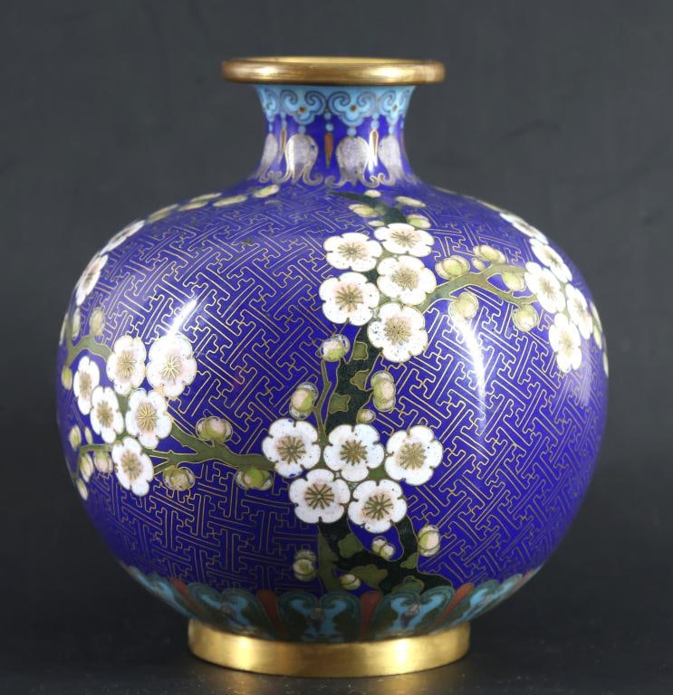 Lao Tian Li Chinese Cloisonne Vase: Qing - Republic era globular cloisonne vase with gilt brass mounts, decorated with plum blossoms and peonies over a foliate lappet lower border, the neck featuring lotus blossoms and ruyi, all on a co