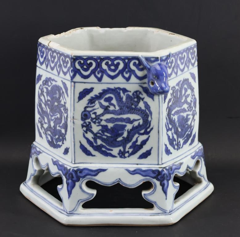 Chinese Blue and White Porcelain Censer: Qing era porcelain hexagonal censer with underglaze cobalt decoration depicting five-clawed dragons chasing flaming pearls and featuring ruyi motifs throughout, with applied qilin mask handles, all ra