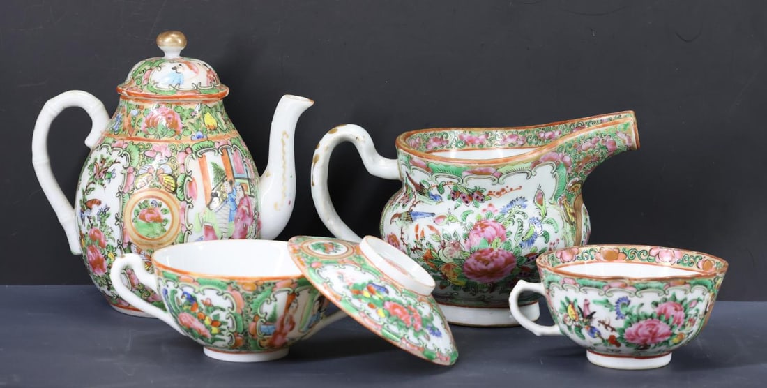 Chinese Rose Medallion Porcelain Tea Wares: Qing - Republic era export porcelain, decorated with motifs including figures in court scenes, birds, butterflies, flowers, and fruit, including a teapot, 6"h x 5.75"w, a creamer, 4.25"h x 6.5"w, a co