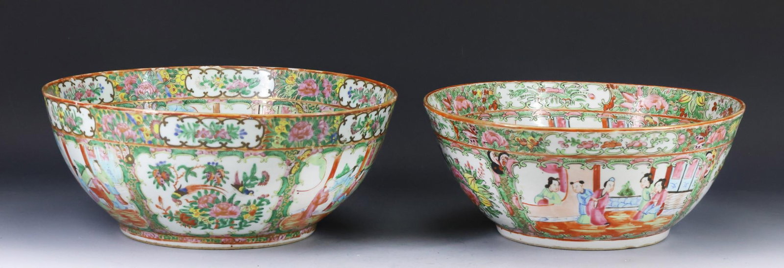 Chinese Rose Medallion Porcelain Punch Bowls: Qing era export porcelain graduated punch bowls, decorated with figures in court scenes, birds, butterflies, flowers, and fruit. The smaller bowl has a tight hairline to the rim, and a flake to the ri