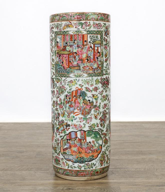 Chinese Famille Rose Porcelain Umbrella Stand: Qing - Republic era porcelain cylindrical umbrella stand, decorated with panels depicting ladies and attendants in court scenes, framed by motifs of dragons and bats, scrolls and ribbons, lozenges and