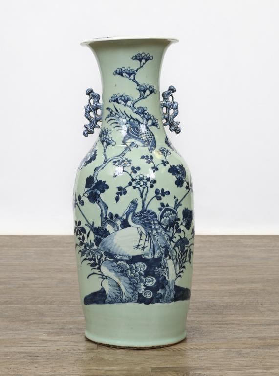 Chinese Blue and Celadon Porcelain Floor Vase: Qing era floor vase with underglaze cobalt decoration depicting a pair of phoenixes among flowers on a crag on a celadon ground, with stylized Kui dragon handles and a flared rim. 23.5"h x 9"w
