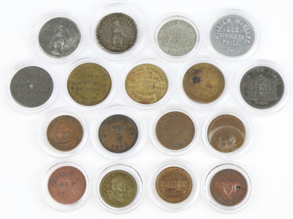 Late 19th Century Philadelphia Trade Tokens: Collection of 15 Philadelphia trade tokens including; 1.) GA Walther, Wines & Beers, 412 Library St. Token presents Continental soldier on reverse is white metal and measures 23mm. 2.) John E. Vallee,