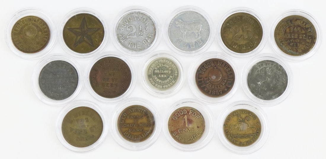 Late 19th Century/Early 20th Century Philadelphia Trade Tokens: Collection of 15 Philadelphia trade tokens including; 1.) Dr. N.B. Leidy, Blood Purifiers, 217 North 6th St. Token presents Dr. D.L. Flemming, 635 Vine St. on reverse is white metal and measures 23mm.
