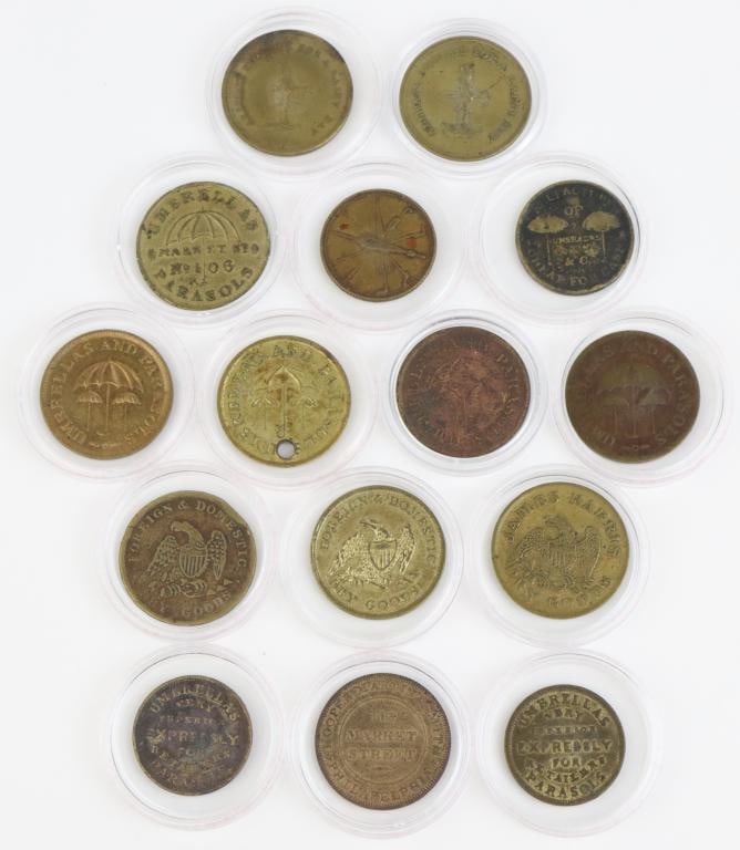 Late 19th Century Philadelphia Trade Tokens: Collection of 15 Philadelphia trade tokens including; 1.) William H. Richardson, Umbrellas and Parasols, 418 Market St. Token presents product information in text on reverse is brass and measures