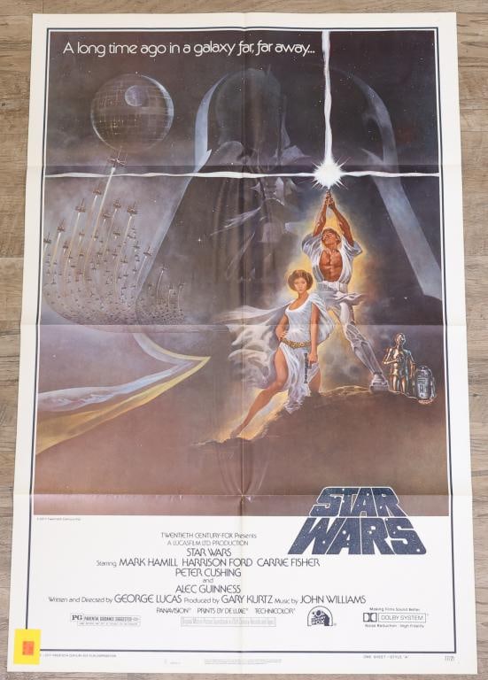 Star Wars Episode IV- A New Hope Poster: Star Wars original 1977 one sheet movie poster, style A, 77/21 print run, folded. 41”h x 27”w. Artwork by Tom Jung.
