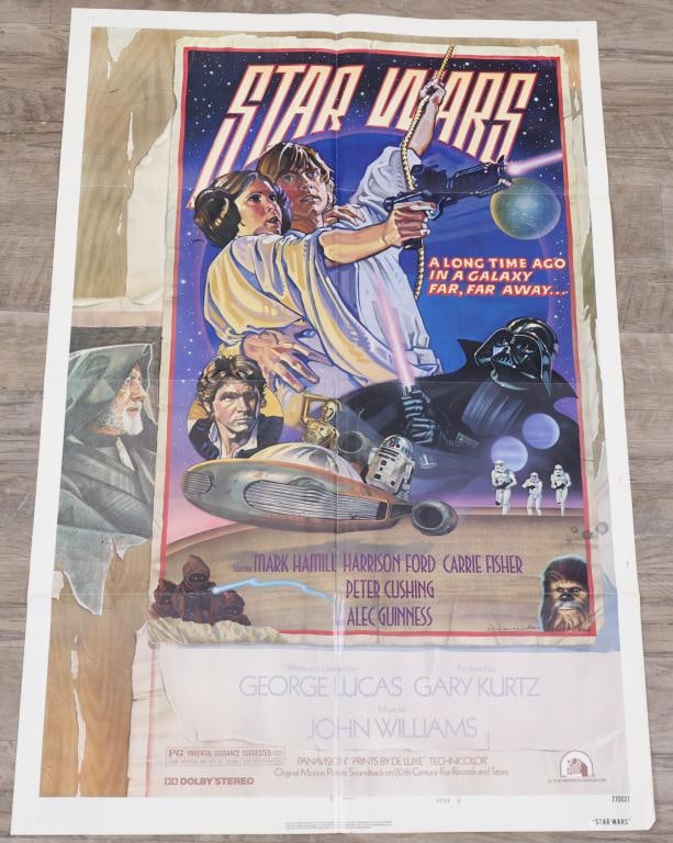 Star Wars Episode IV- A New Hope Poster: Star Wars original 1978 one sheet movie poster, style D, 770021 print run, folded. 1.75” tear to bottom left quadrant, small tear in lower middle at crease. 41”h x 27”w. Artwork by D