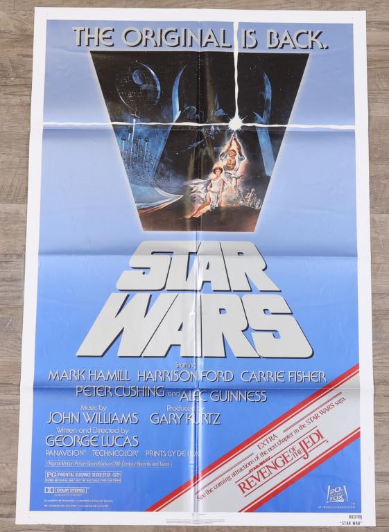 Star Wars Poster: Star Wars re-release 1982 one sheet movie poster promoting the upcoming release of “The Revenge of the Jedi”, R820106 print run, folded. 41”h x 27”w. Artwork by Tom Jung.