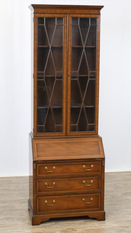Kittinger Inlaid Secretary Desk: A "Buffalo Collection" two-part secretary having a mahogany case with banded inlay throughout, a molded cornice, two doors over a slant front desk opening to a fitted interior over three graduated