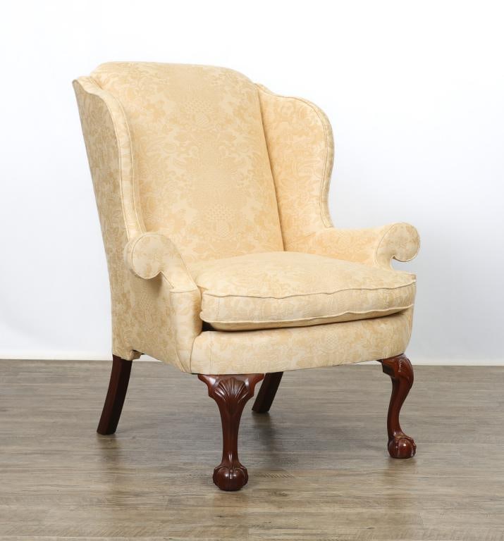 Kindel Wing Back Armchair: Mahogany frame, scrolled arms, Textured upholstery with damask design, cabriole legs with carved shell knees on claw and ball feet. 44"h x 40"w x 35"d, 22"h seat height