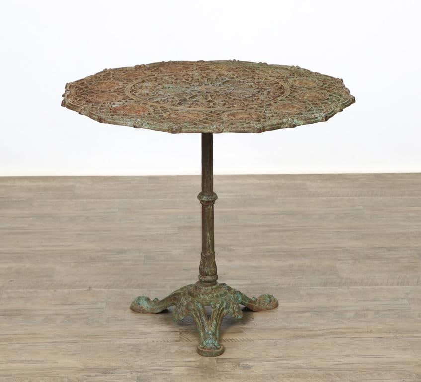 French Cast Iron Zodiac Garden Table: Circular c-scroll shaped top surrounding lattice and Zodiac symbol and month cartouche outer layer with a c-scroll, foliate, and rosette inner layer with center foundry mark "Saux Founderie