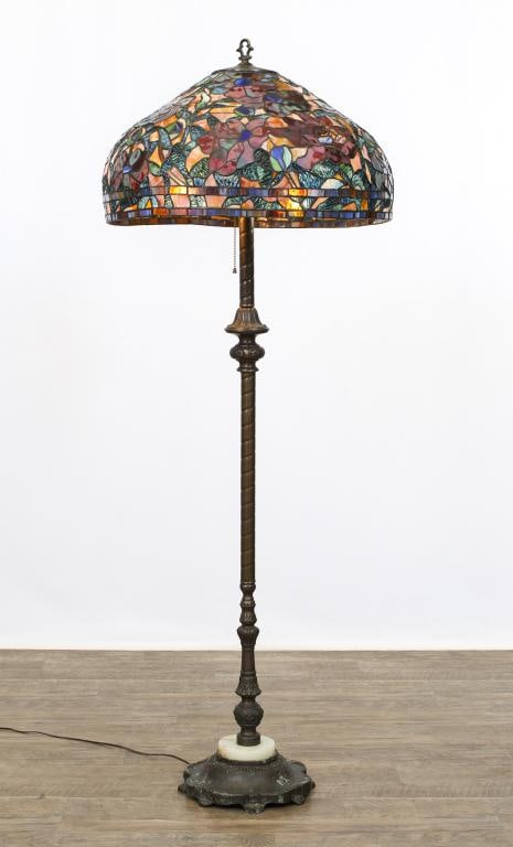 Leaded Slag Glass Floor Lamp: Foliate slag glass shade over a steel acanthus and floral turned stem on an onyx and white metal scalloped base. In working condition. 65"h Overall, 13"h x 24"w (shade)