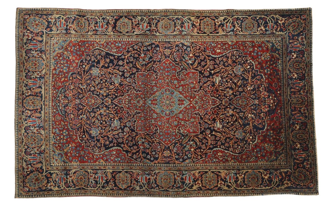 Persian Kashan Rug: Hand knotted with an oval pole medallion within an eight lobe central pole medallion surrounded by a floral and foliate field and spandrels, and an alternating meandering palmette and floral main