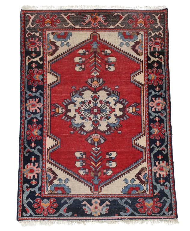 Persian Bijar Rug: Hand knotted having a central cloud collar floral and foliate pole medallion in a red ground with a meadering floral cartouche and vine main border. Other multi-colors of navy and light blue, cream,