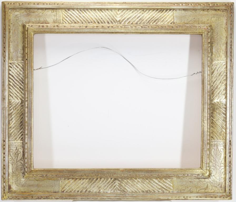 Carl Dennis Laughlin (1921-2012): Hand carved frame, decorated with geometric crosshatch and foliate motifs in a gilt finish. Rabbet measures 16" x 20"; outside dimensions 23" x 27.5".