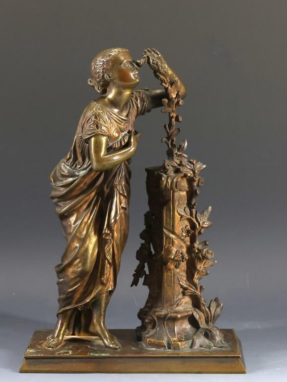 Allegory of Spring Sculpture: Bronze sculpture, an allegory of spring, depicting a young woman in Classical dress wrapping a column in garland and stopping to smell the flowers. Impressed "BAR" near the base. 11.5"h x 8"w x 3.5"d