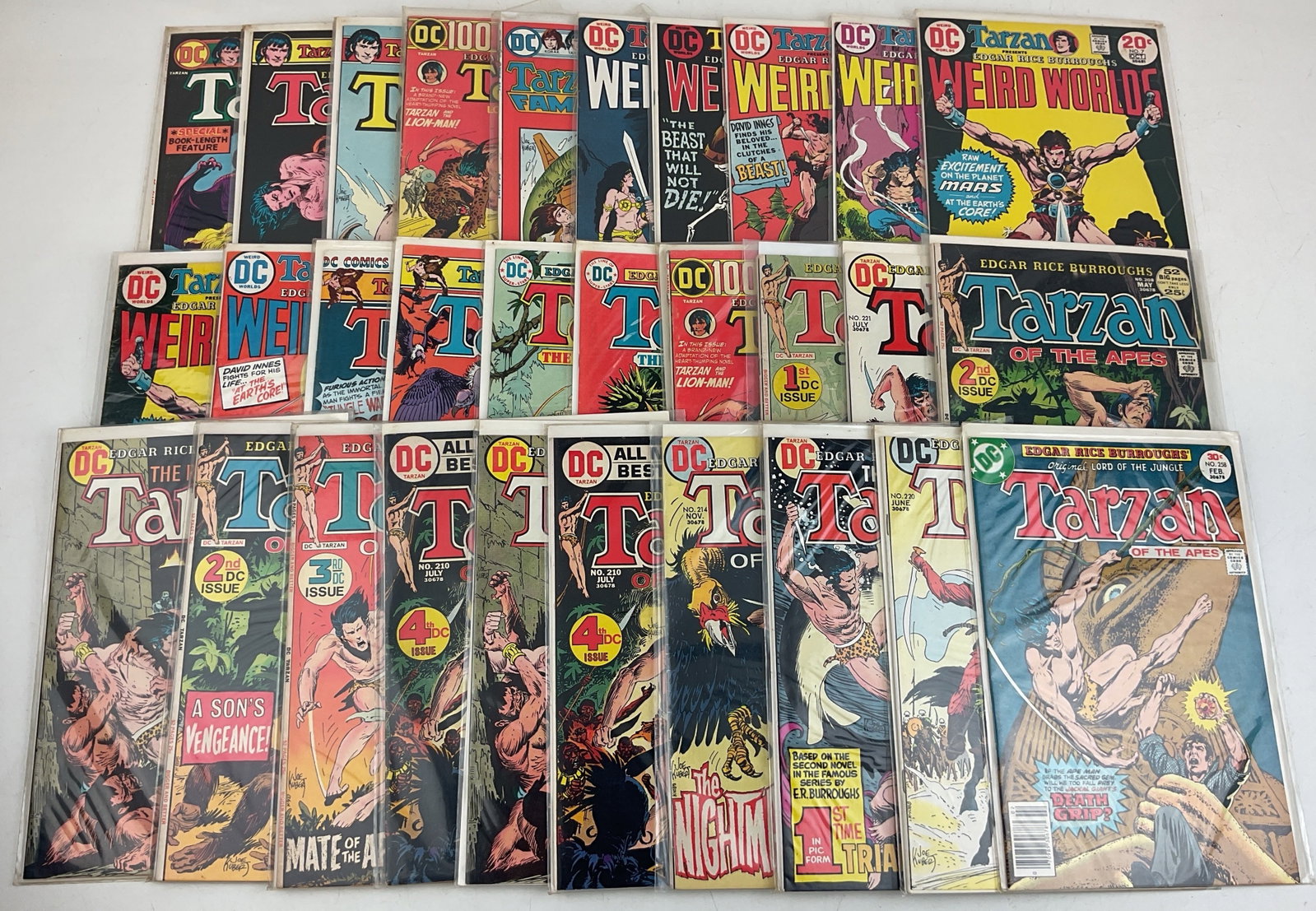 Tarzan Comics: (30) Assorted Tarzan and Weird World comics. Condition varies.