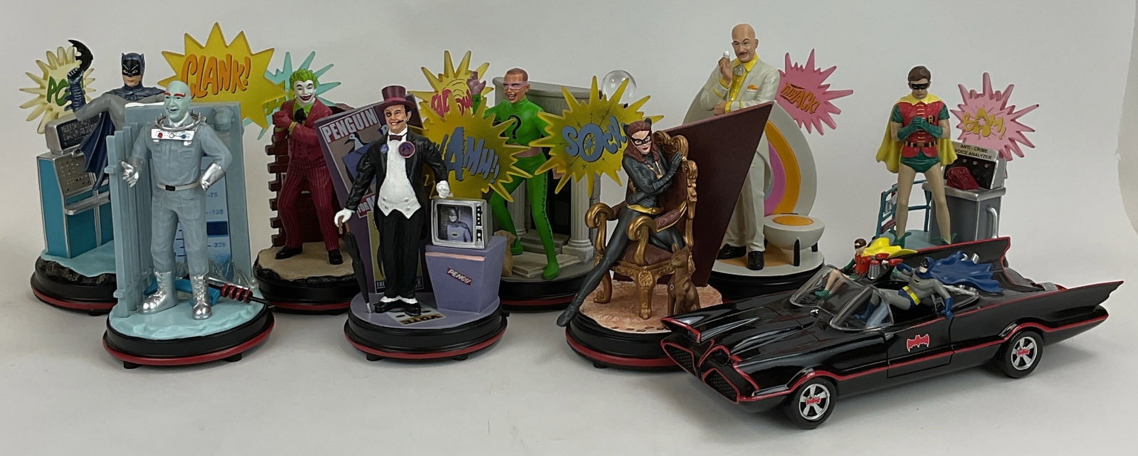 Bradford Exchange Batman 1966 Illuminated Figures & Batmobile: Bradford Exchange DC Comics Batman Classic TV Series illuminated collection (9), comprising an illuminated 1966 Batmobile replica and eight distinct character diorama figurines. The lot includes