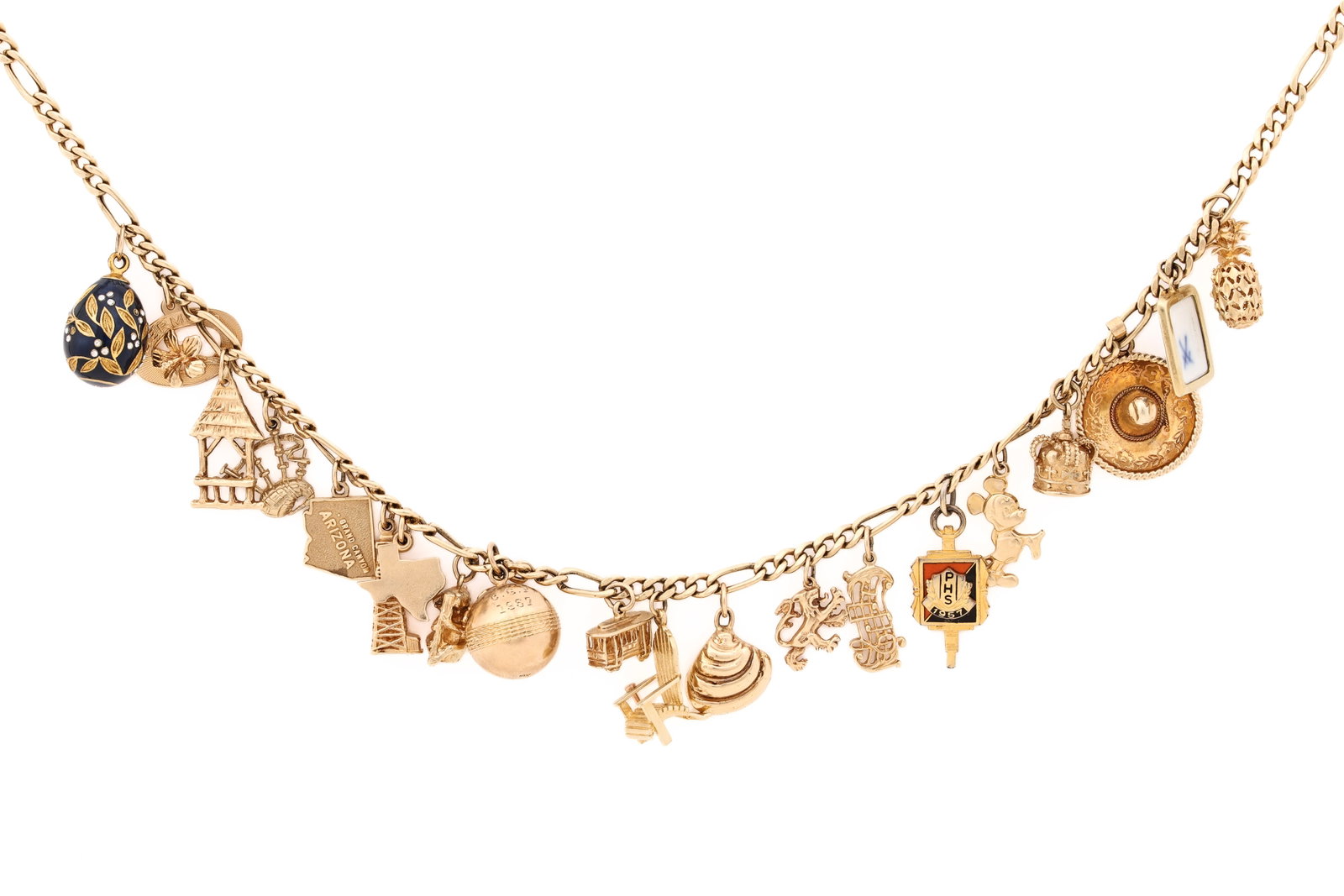 14K YG Charm Necklace: 14K yellow gold figaro link charm necklace with assorted 14K gold charms, together with 10K gold sheet music, crown, trolley, Princeton sphere, panda, Arizona and bagpipe charms, a Princeton gold