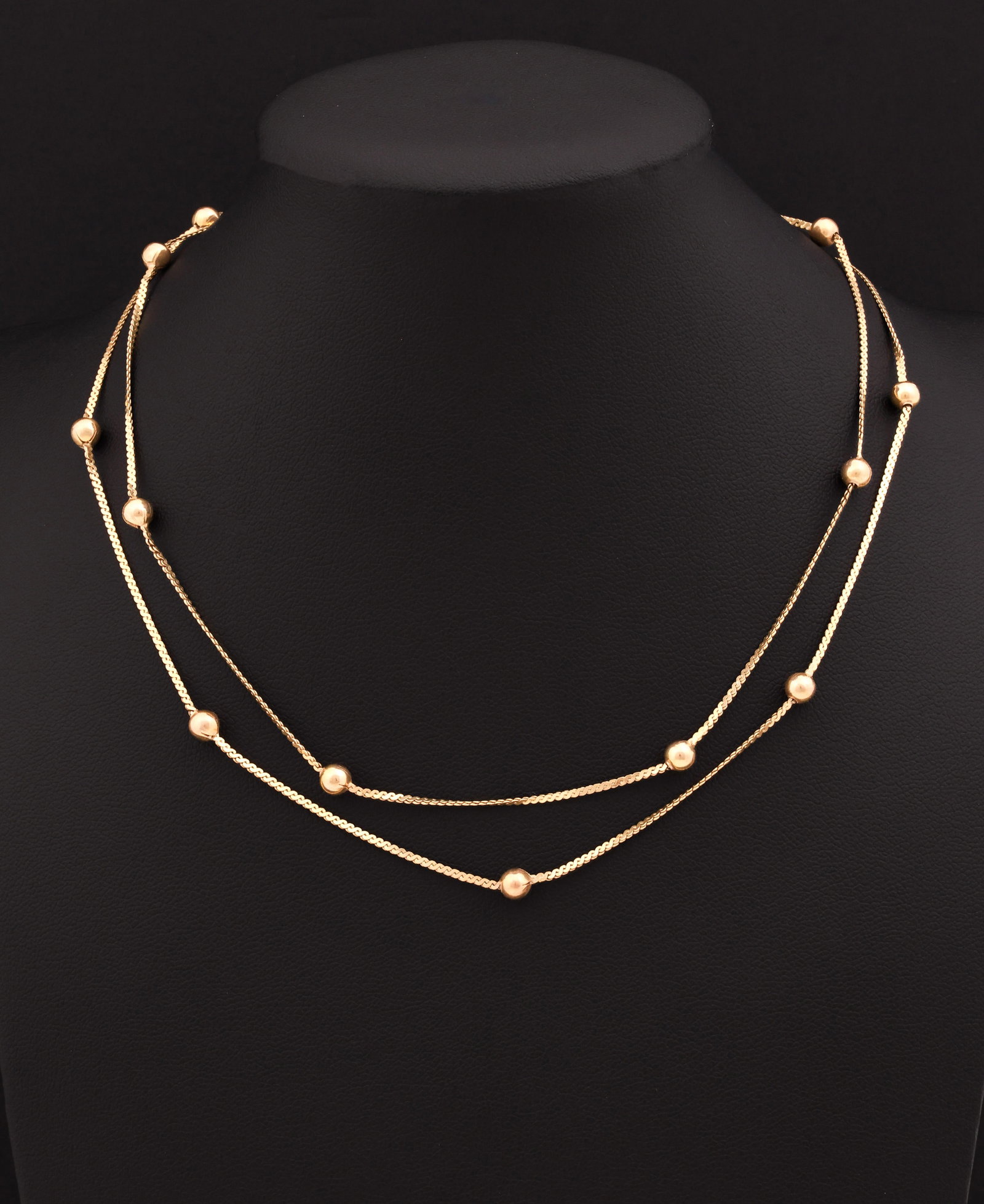 14k YG Necklace: 14K yellow gold station necklace with polished bead accents. 29"l. 5.1 dwt.