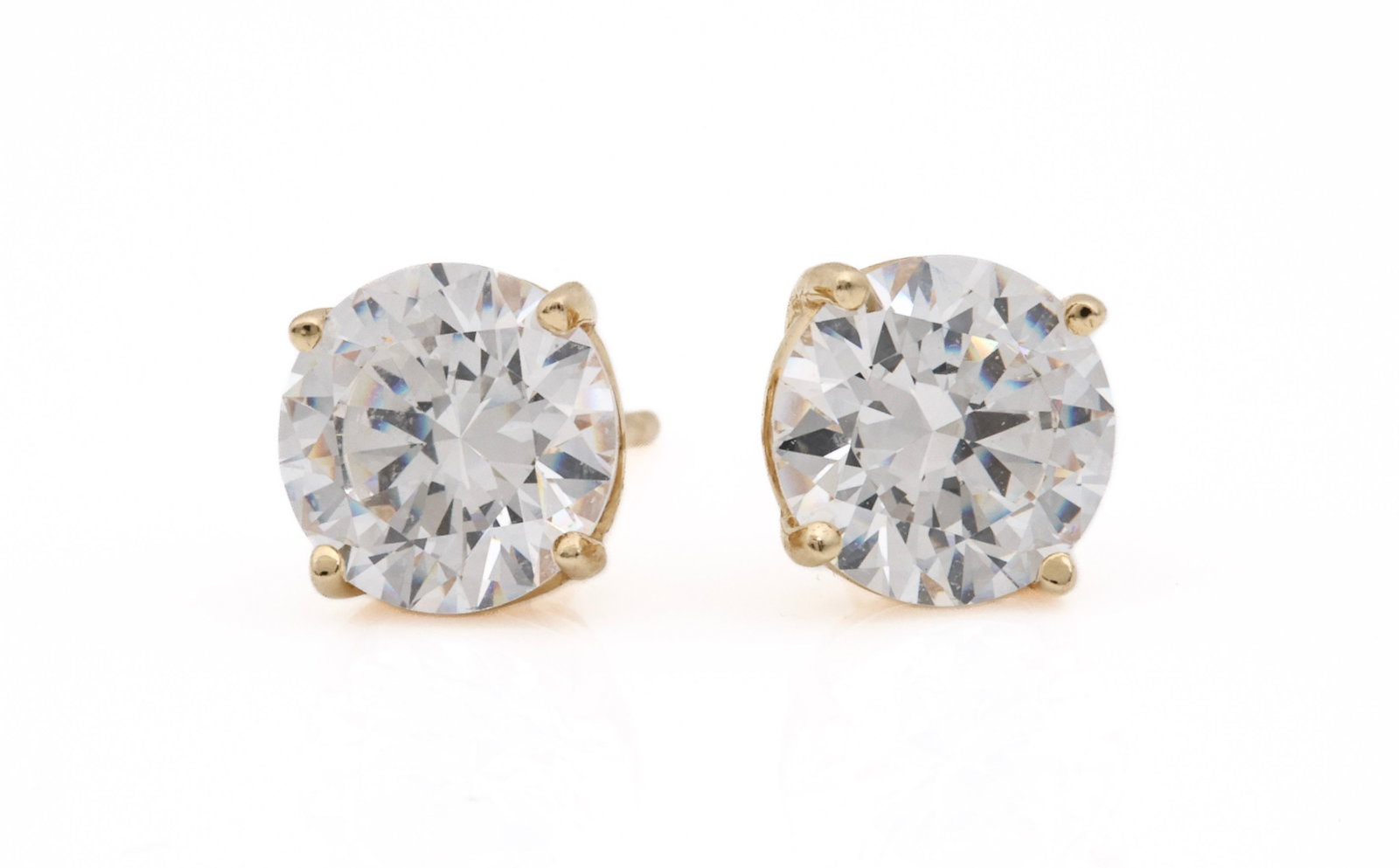 14k YG Diamond Earrings, 1 Carat: 14K yellow gold diamond stud earrings with two round brilliant diamonds, approximately 1.00 carat each, H-I color, SI2 clarity. 0.9 dwt.