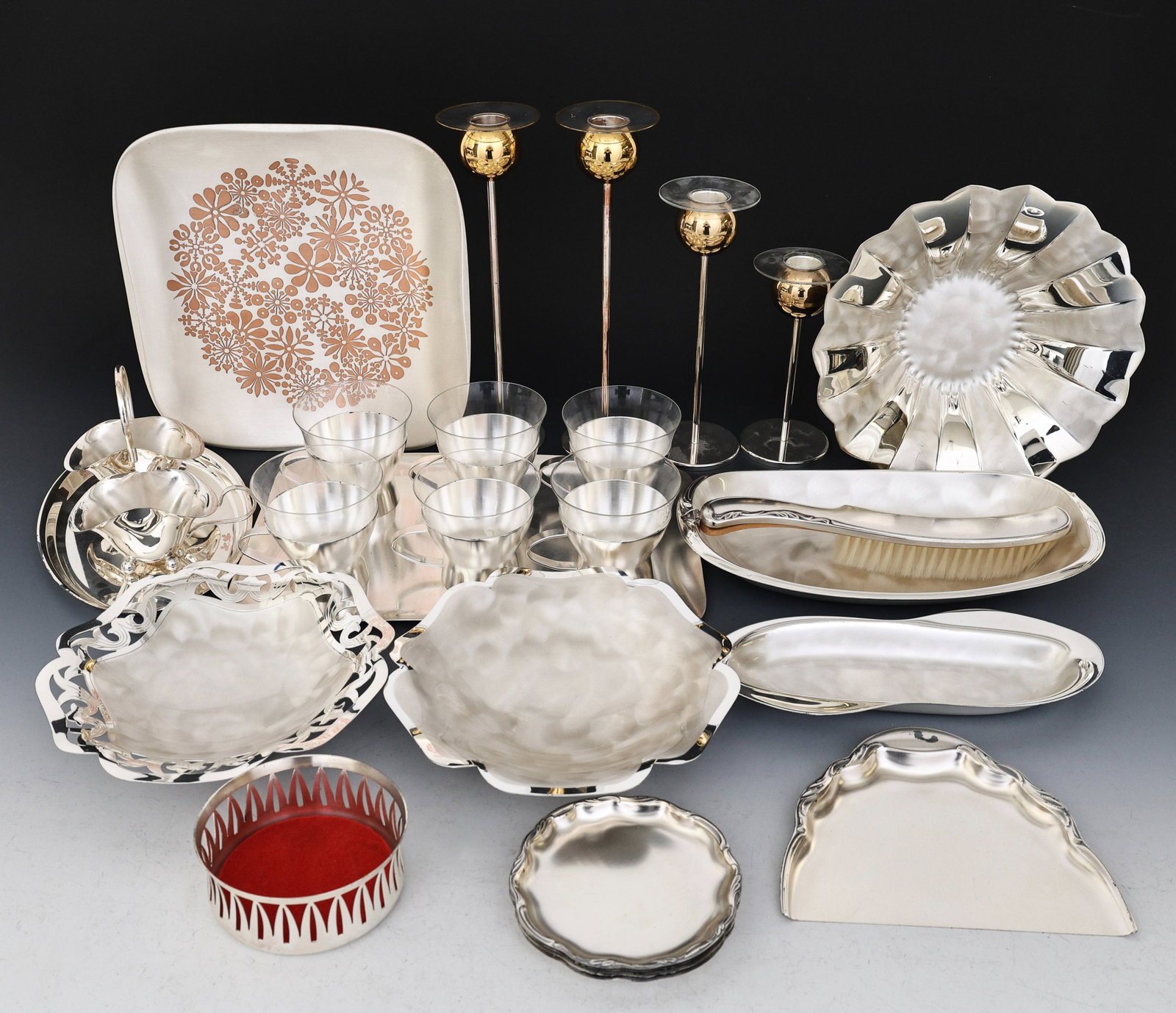 WMF Ikora Tablewares: German Modern silver plated tablewares, some pieces designed by Gunter Kupetz, including a 10"square serving dish with copper floral decoration, a 1.5"h x 11"w x 6"d oval serving dish, a 2.5"h x 9"w s
