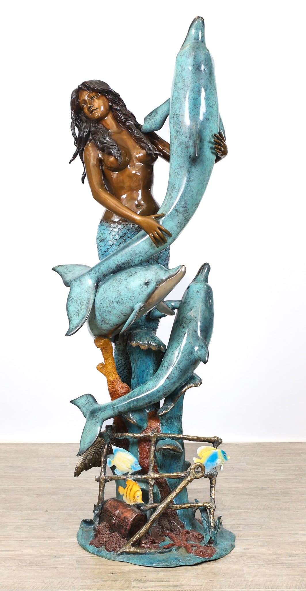 Bronze Mermaid and Dolphins Sculptural Fountain: Bronze sculptural fountain, a patinated and enameled life-size depiction of a mermaid surrounded by dolphins and other sea life, the dolphins with water spouts. Impressed Paulo St. Regis to the base. 