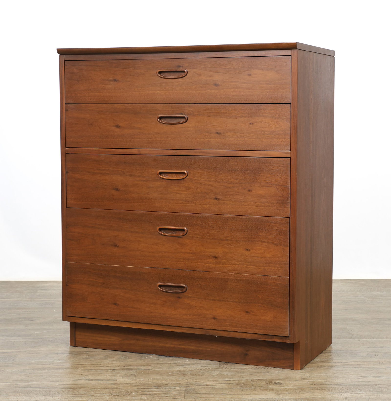 Lane "Reflection" Chest: No. 305-14 bookmatched walnut chest with two shallow drawers over three deep drawers, a formica top, and an set-back base. Part of the "Teen Mates" subseries. Stamped to the interior of a drawer and