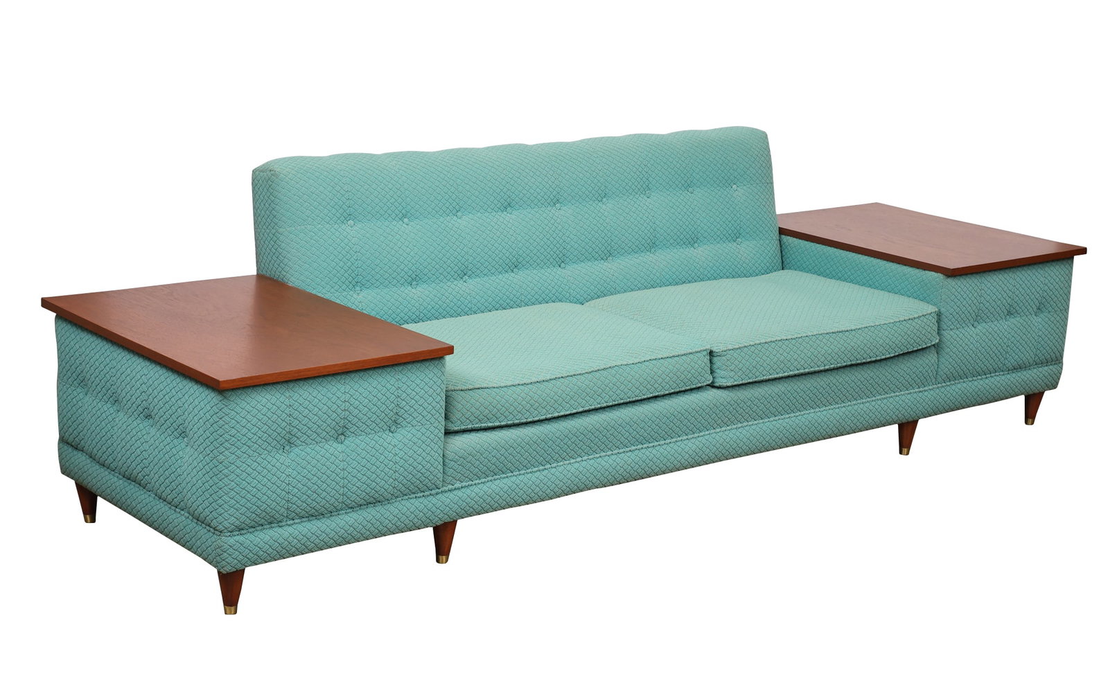 Sofa With Integrated Side Tables: Sofa with textured and tufted turquoise upholstery, each side featuring an integrated walnut table top with a fitted glass surface, raised on tapered round legs with brass caps. 30"h x 104.5"w x