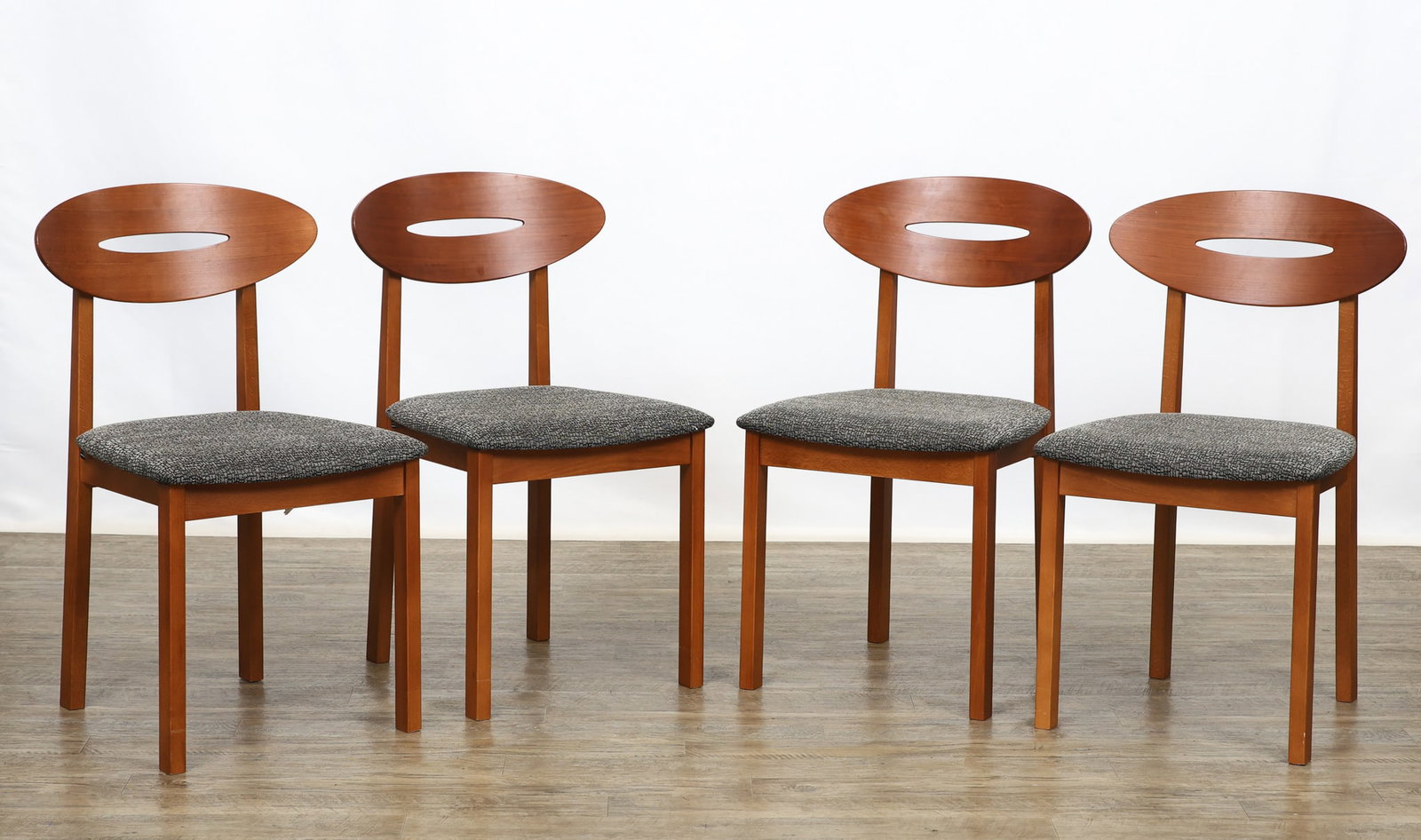 Skovby "No. 94" Dining Chairs: Danish Modern cherry side chairs with curved elliptical back supports with a cut-out, floating seats with gray and black patterned upholstery, square straight front legs, and square tapered stiles.