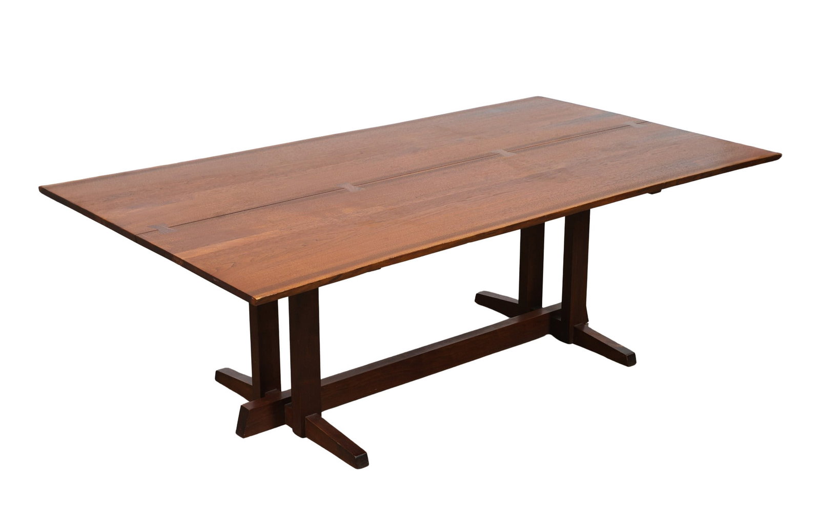 George Nakashima Frenchman's Cove II Dining Table: Walnut, having a double slab book-match free edge top with cross-sectional rosewood butterfly key inlay joinery over a four-legged trestle base, handcrafted at George Nakashima Woodworkers in New
