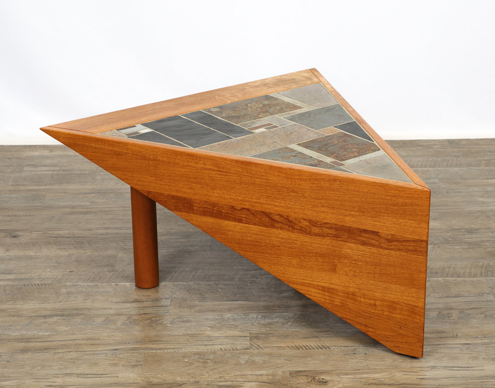 Lisbeth and Peter Sallingboe Tile Top Teak Wedge Table: Danish Modern triangular teak coffee table with an inset slate and ceramic tile mosaic top, two triangular sides, and two straight round legs. Made by Elizabeth (Lisbeth) and Peter Sallinboe for