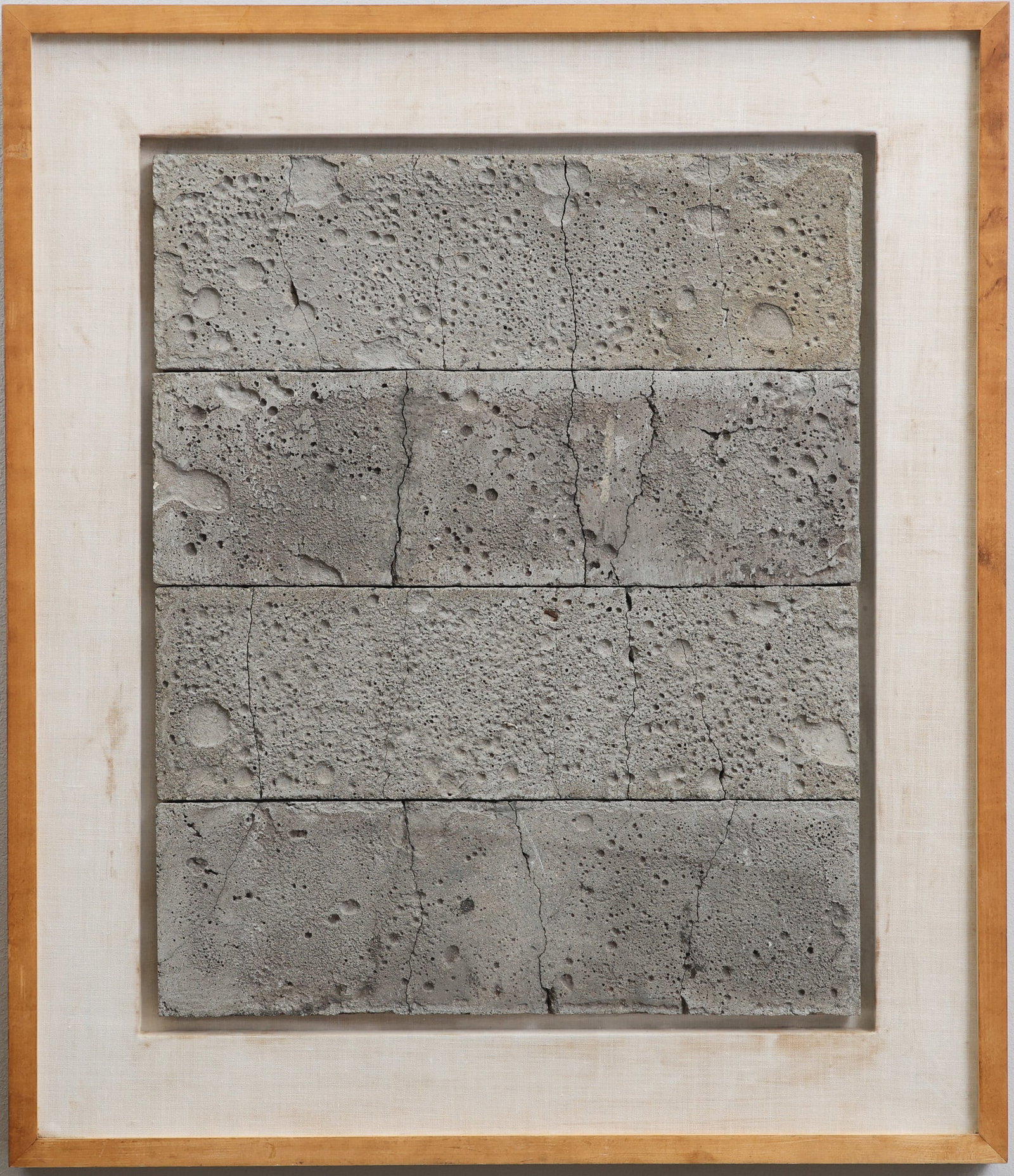 Julius Tobias (1915 - 1999): Found art sculpture made from concrete slabs mounted in a shadowbox frame, "The Cult of the Beautiful", dated 1975, stamped to the frame en verso. Overall 33"h x 28"w, stone 24"h x 20"w
