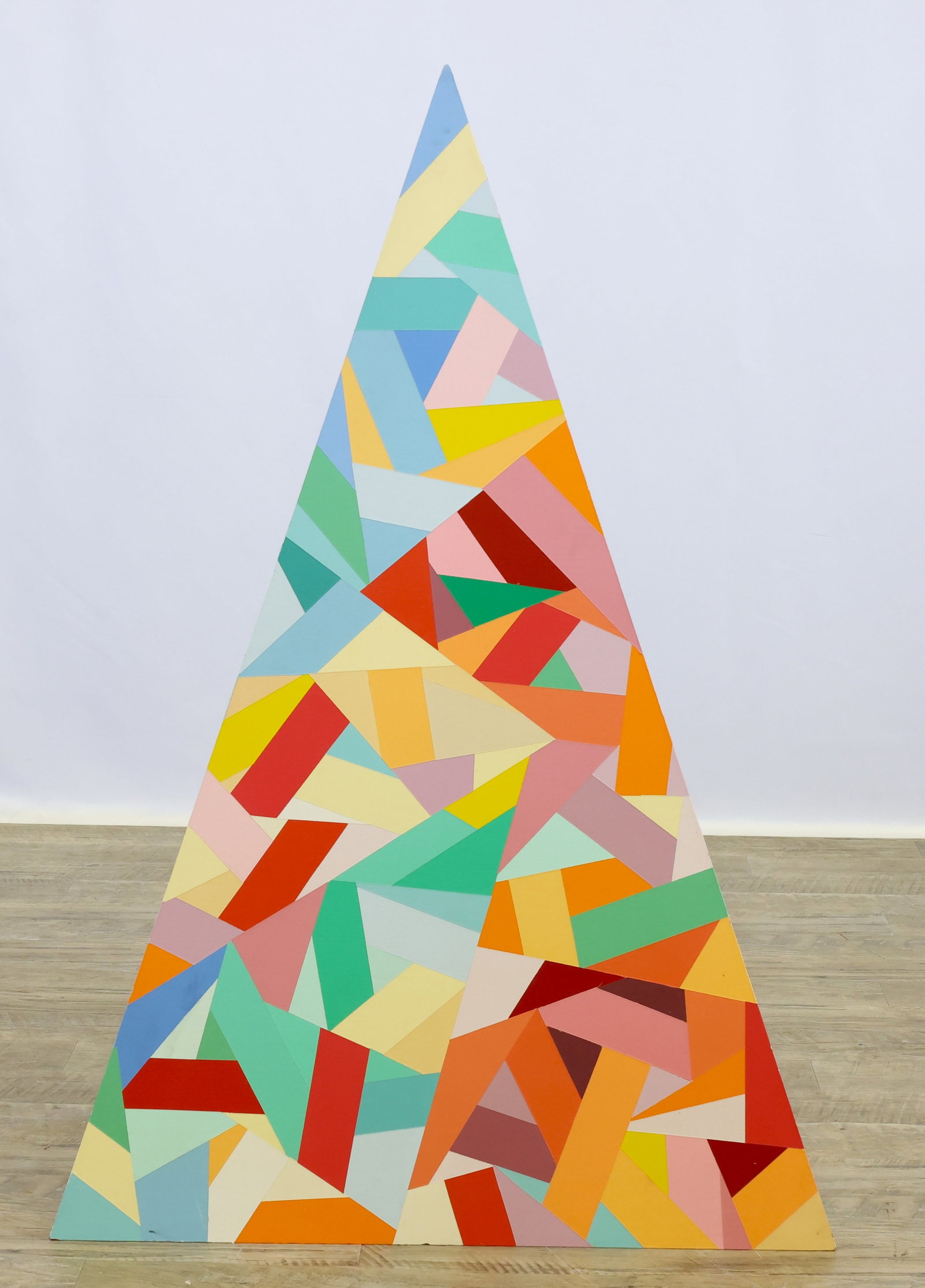 Dennis Will (20th/21st c.): Pyramid constructed from high density fiberboard, signed and dated on the inside, 1982. Surface is collaged on all three sides with wide strips of color fitted with triangular shapes giving an