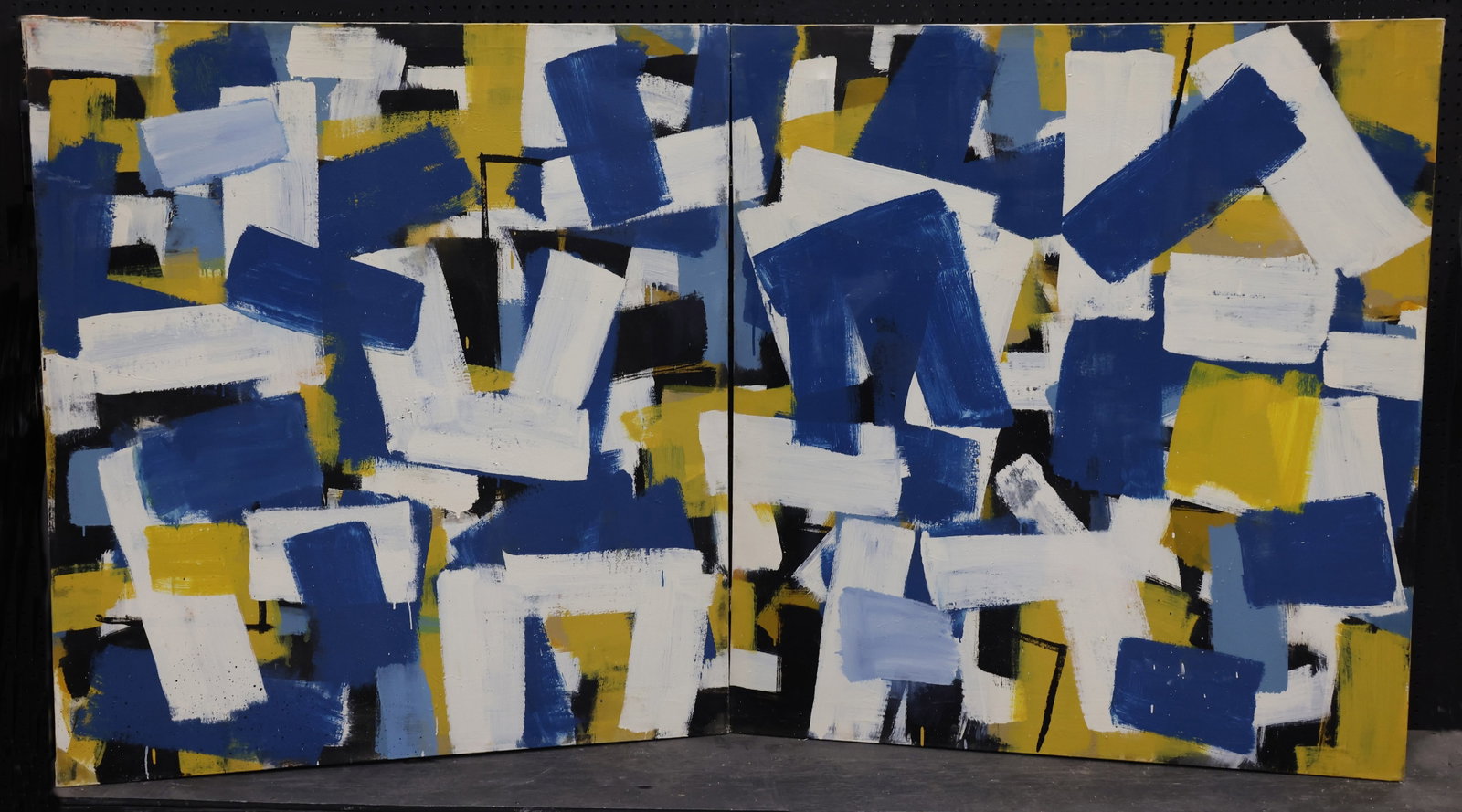 Louis Tavelli (1914-2010): Oil on canvas, unsigned by the artist. Part of the artist's "Large Brush Abstracts" series. Diptych abstract completed in blue, white, yellow, black, and light blue. Each canvas 50"h x 46"w unframed