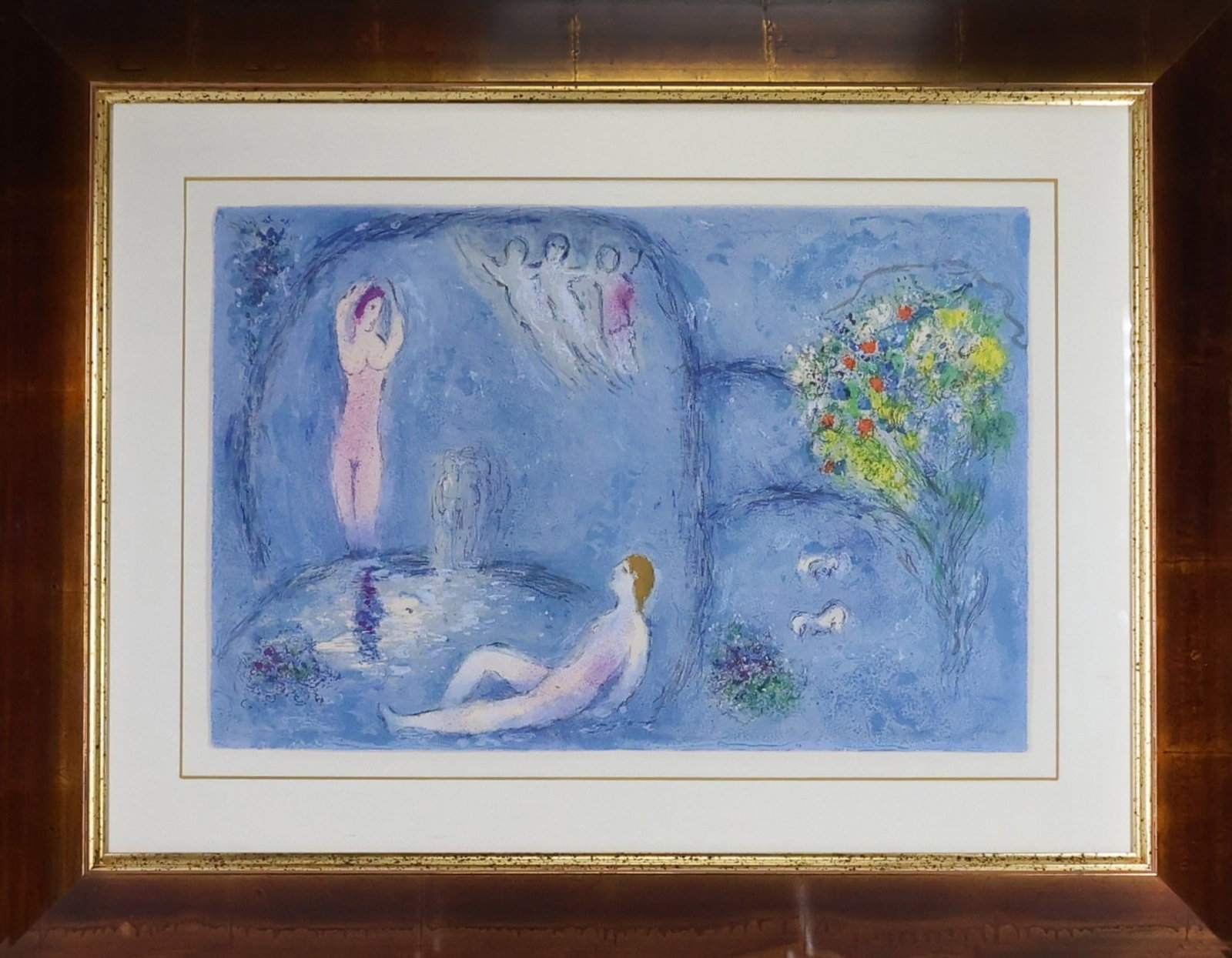 Marc (Moishe Shagal) Chagall (1887-1975): Color lithograph on wove paper, "La Caverne des Nymphes," from Daphnis et Chloé, 1961. Modernist composition with figures, flowers and pastoral imagery in a dreamlike blue landscape. From the