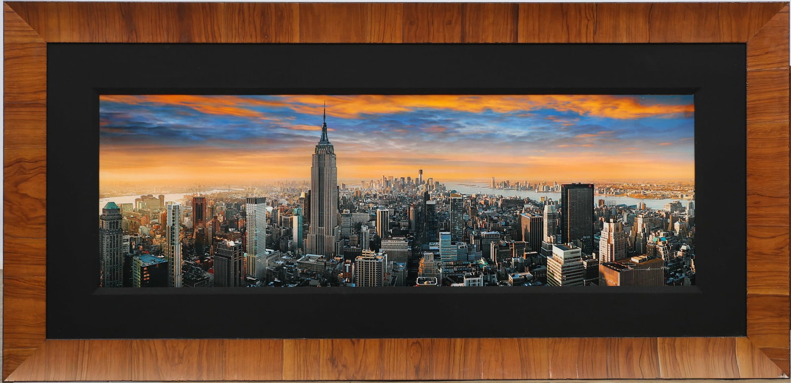 Peter Lik (b. 1959): C-print, "Metro Aurora", signed and numbered lower right, 69/950. panoramic photograph of the Manhattan skyline at sunrise with the Empire State Building center and Lower Manhattan in the distance.