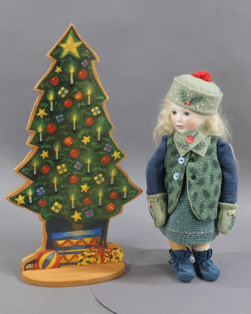LYNNE & MICHAEL ROCHE.: LOT. 10 1/2" Tagged "Dorothy with Tree" doll, 11/50, 03'. Bisque head with stationary blue glass eyes. Open/closed mouth. Pale blonde mohair wig. Fully jointed wooden body with bisque hands. Dressed