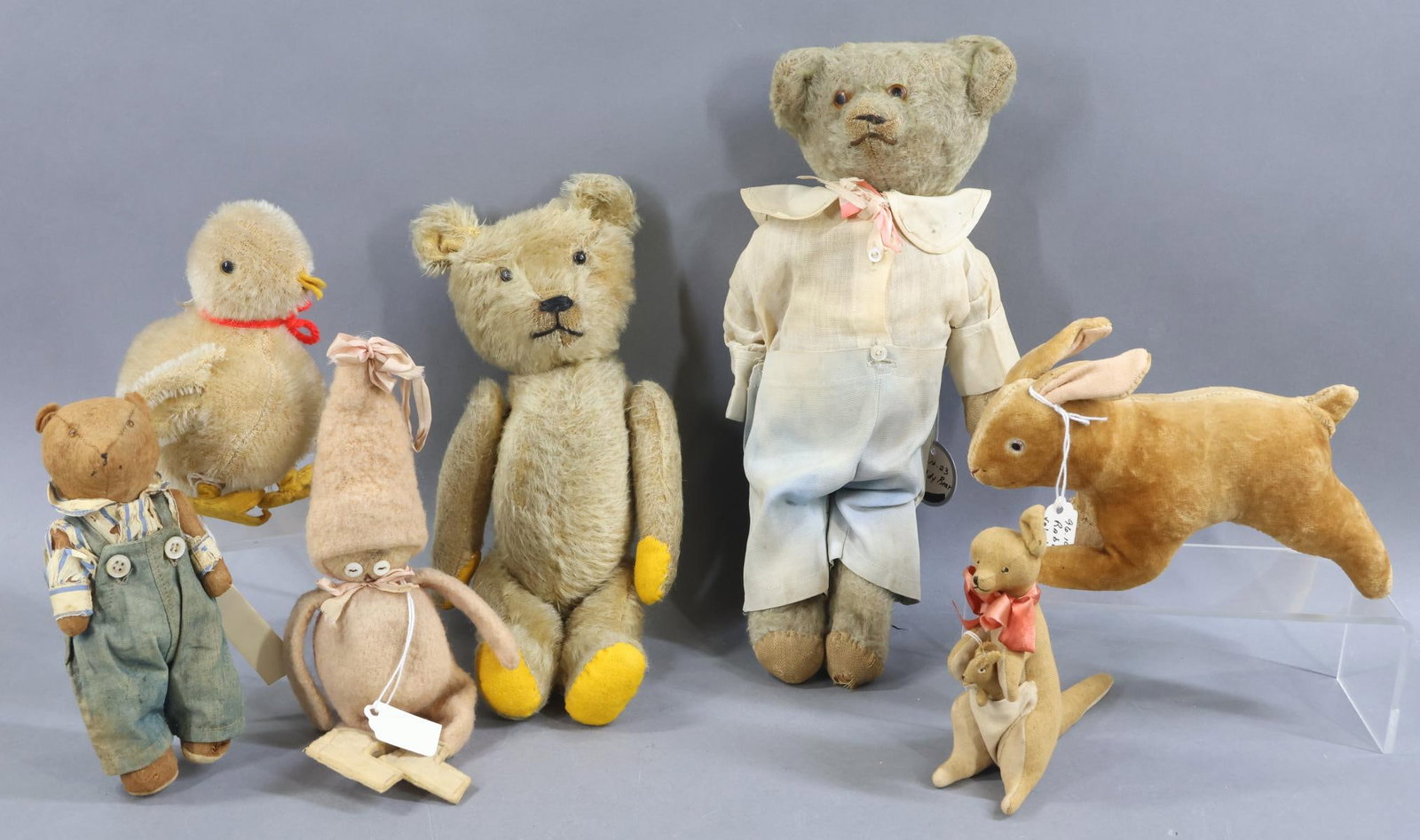VINTAGE ANIMALS.: MUSEUM DEACCESSION LOT. Pair of camel mohair bears. Both bears have glass eyes, swivel heads and are fully jointed. The dressed bear has antique clothing. Condition: both bears have age loss and have 