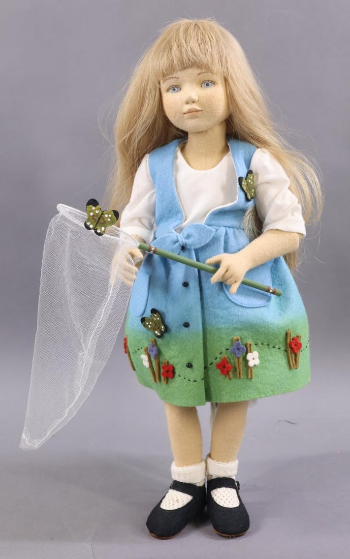 MAGGIE IACONO.: 16" Tagged "Linnea", 46/60. Honey blonde HH wig. She has her butterfly net with her. No box. Stand. Condition: nothing observed. This lot is being sold AS IS.