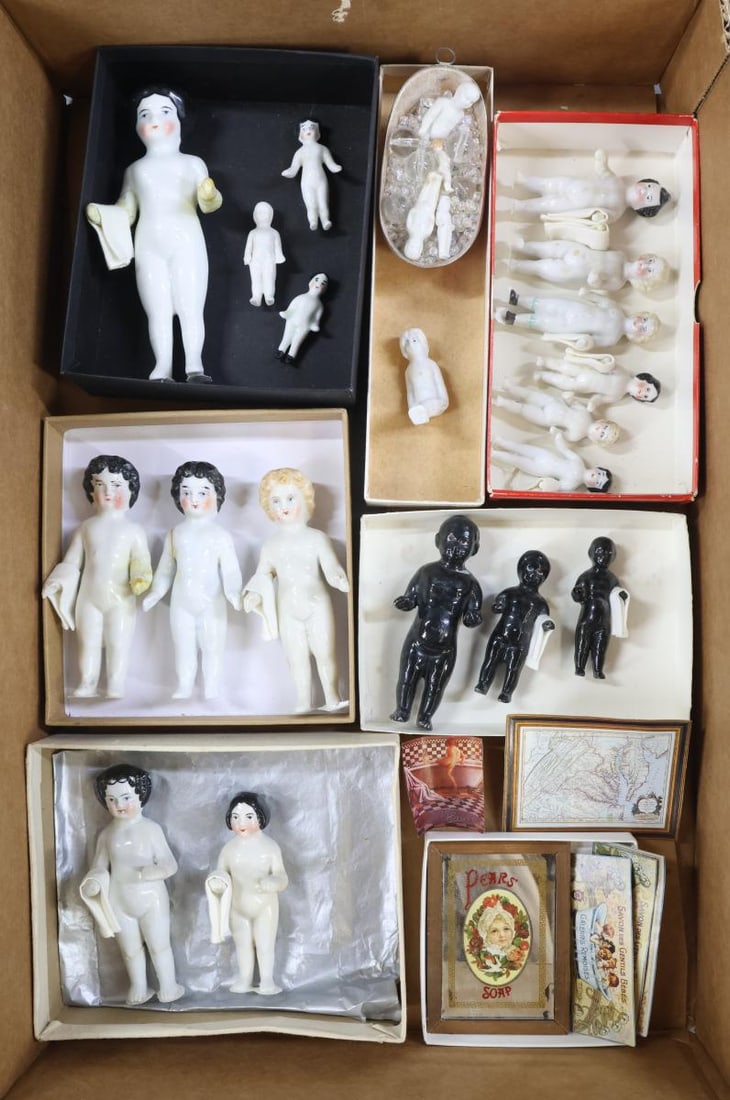 CHINA DOLLS.: LOT. (15) China "Frozen Charlotte" Bathing dolls. 1 3/4" - 5 1/2". Painted blonde and black hair. Condition: (5) have been repaired. (3) Black Bathing dolls 2 1/2" - 4". Condition: (1) has been
