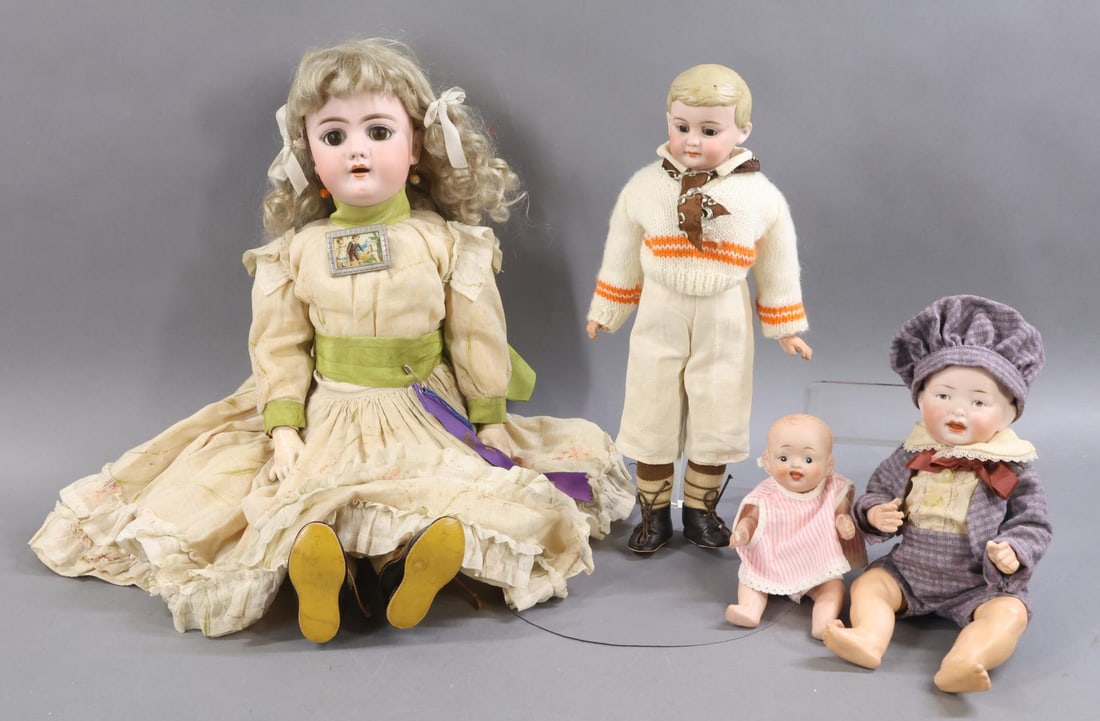 GERMAN BISQUE DOLLS.: LOT of (4) dolls. (3) GERMAN - Doll 1) 20" 109 - 11 H 22 1/2 (Handwerck)) with brown sleep eyes, open mouth, pierced ears, very curly blonde mohair wig, plaster pate. Papier mache ball jointed body.